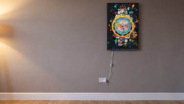 Luxury Time LED canvas on a living room wall, its clear USB lead running to a plug adaptor in a standard UK socket